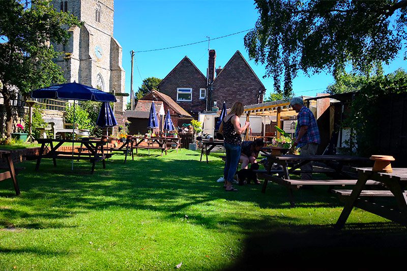 The local pub and garden, The Bell Inn, is located in front of St George’s Church in Ivychurch as part of JAM on the Marsh.